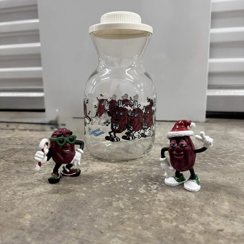 1989 Lot California Raisins Glass Carafe w Lid + 2 Christmas PVC Figures Vintage